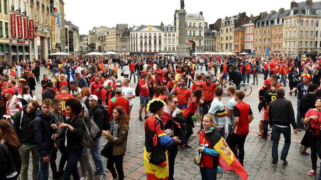 Wales and Belgium fans soak up the atmosphere in Lille prior to the quarter-final match at the Stade Pierre Mauroy. Photograph:Joe Giddens/PA Wire