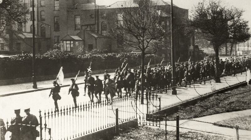 Volunteers from Éamon de Valera’s 3rd Battalion marching down Grand Canal Street Lower under escort after their surrender at Boland’s Bakery. A white ‘x’ has been marked above de Valera. Photo: The National Library of Ireland