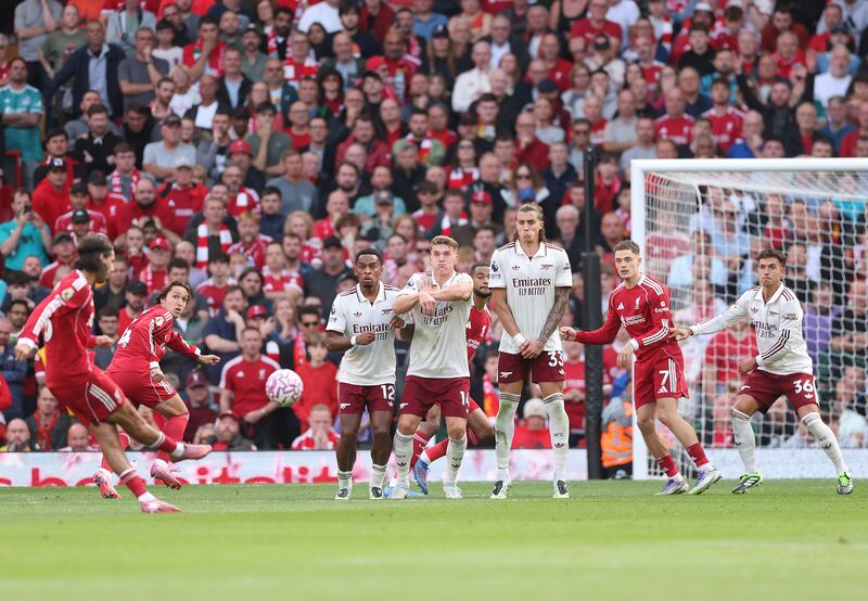 LIVERPOOL, ENGLAND - AUGUST 31: Dominik Szoboszlai of Liverpool scores his team's first goal in a free kick during the Premier League match between Liverpool and Arsenal at Anfield on August 31, 2025 in Liverpool, England. (Photo by Alex Pantling/Getty Images)
