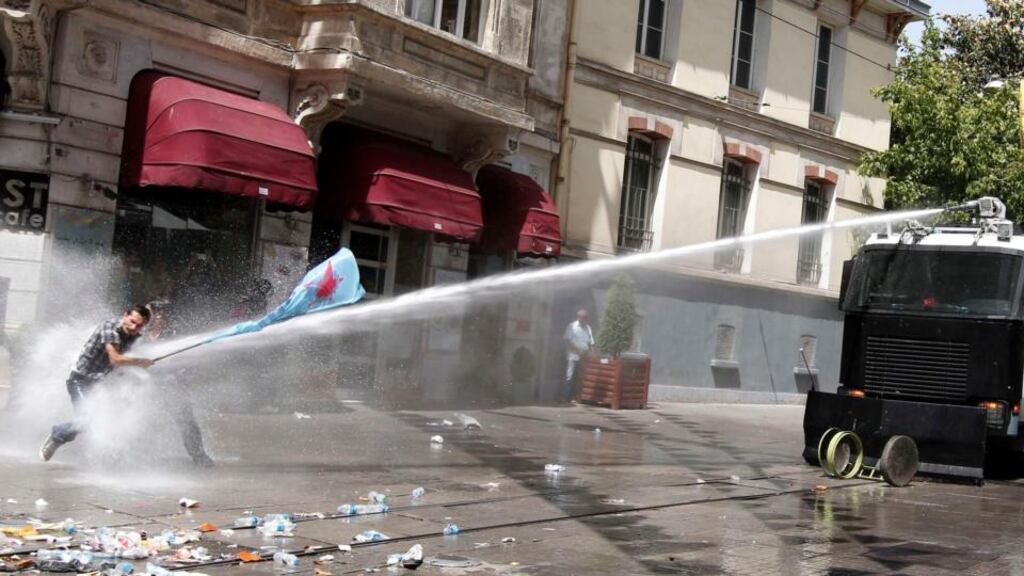 Riot police use a water canon against a protester during an anti-government protest at Taksim Square in central Istanbul today. Turkish police fired tear gas and water cannon for a second day to prevent hundreds of protesters reaching the central Taksim Square, scene of violent protests in which hundreds were injured yesterday. Photograph: Murad Sezer/Reuters