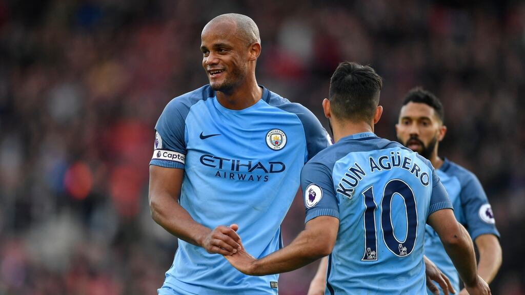 Manchester City’s Vincent Kompany celebrates with Sergio Aguero after the striker’s goal against Southampton. Photograph: Tony O’Brien/Reuters