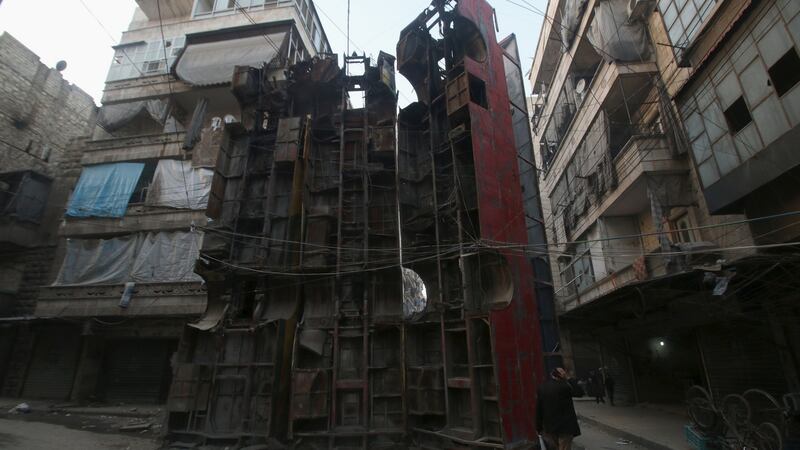 Upended buses serve as obstacles to snipers in Aleppo’s rebel-controlled Bustan al-Qasr neighbourhood, Syria, April 6th, 2016. Islamic State militants have abducted 300 cement workers and contractors in an area northeast of Damascus, it has been reported. Photograph: Abdalrhman Ismail/Reuters