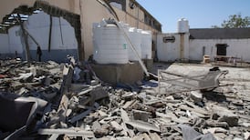 Guards shot at migrants trying to flee air strikes on Libyan detention centre