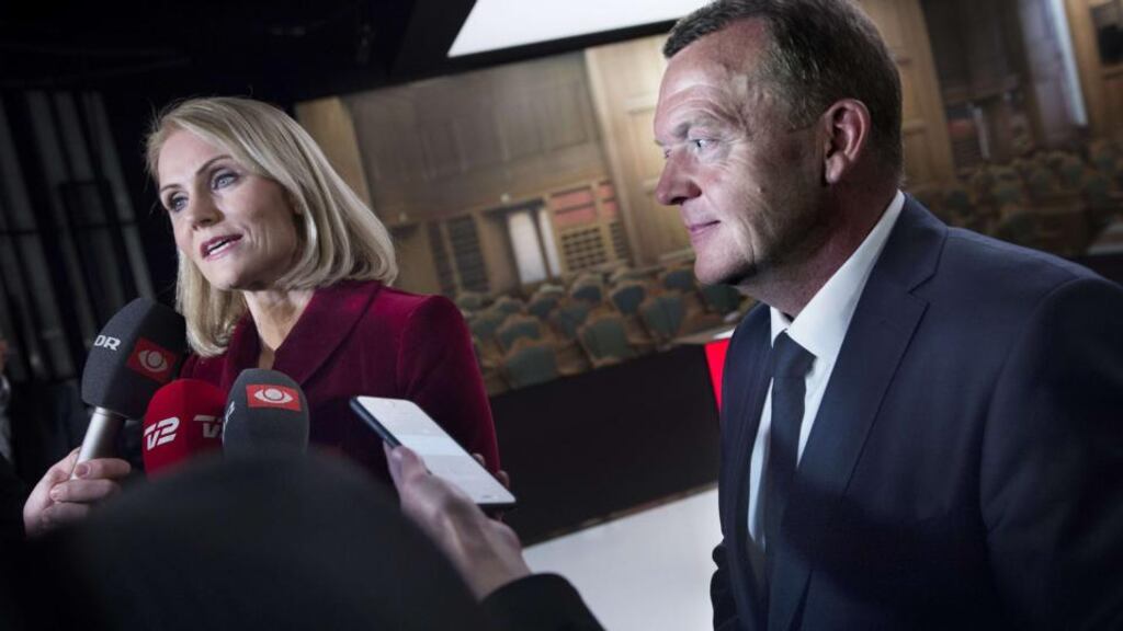 Denmark’s prime minister Helle Thorning-Schmidt and opposition leader Lars Loekke Rasmussen speak to journalists as they arrive for the final televised duel before the election in Copenhagenon. Photograph: Liselotte Sabroe/AFP/Getty Images