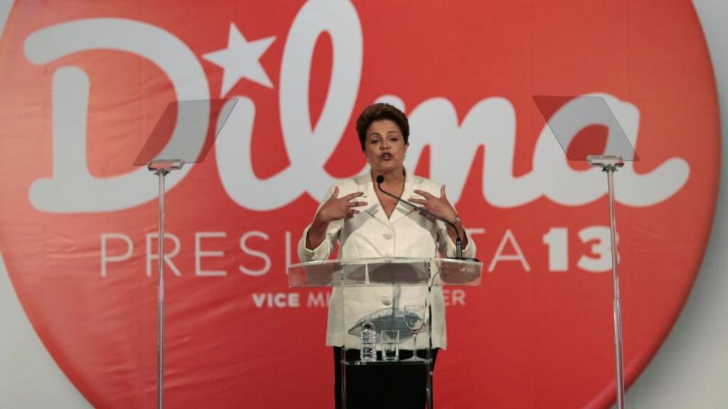 Brazil’s President and Workers’ Party presidential candidate Dilma Rousseff reacts during a news conference after voting in the first round of election in Brasilia. Ms Rousseff placed first in Sunday’s election but did not get enough votes to avoid a runoff and will face pro-business rival Aecio Neves. Photograph: Ueslei Marcelino/Reuters