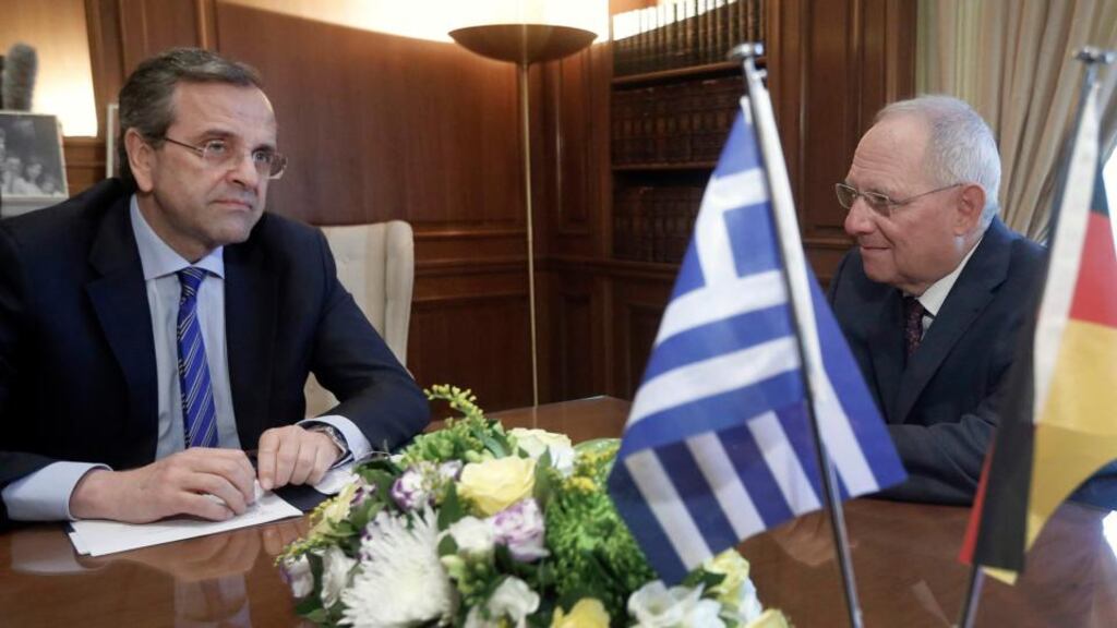 Greek prime minister Antonis Samaras speaks to German Finance Minister Wolfgang Schaeuble (R) in Athens earlier this month. The IMF today approved the latest release of bailout funds which have been keeping Athens afloat. Photograph: John Kolesidis/Reuters.
