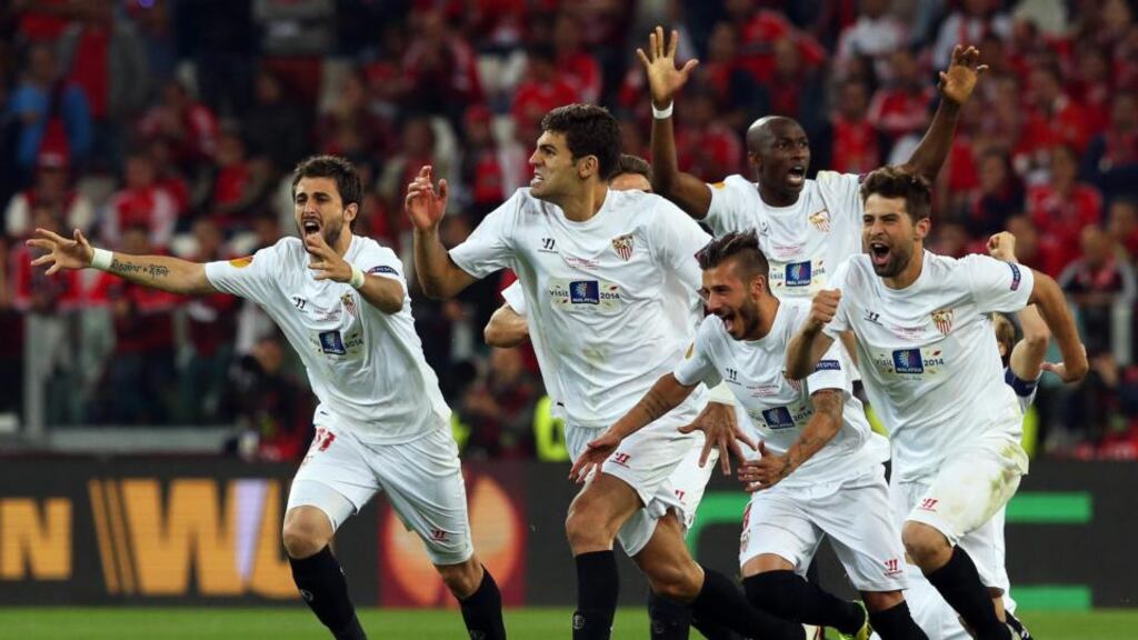 Sevilla players celebrate after winning the Europa League final against Benfica on penalties in Turin last night. Photograph: Srdjan Suki/Epa.