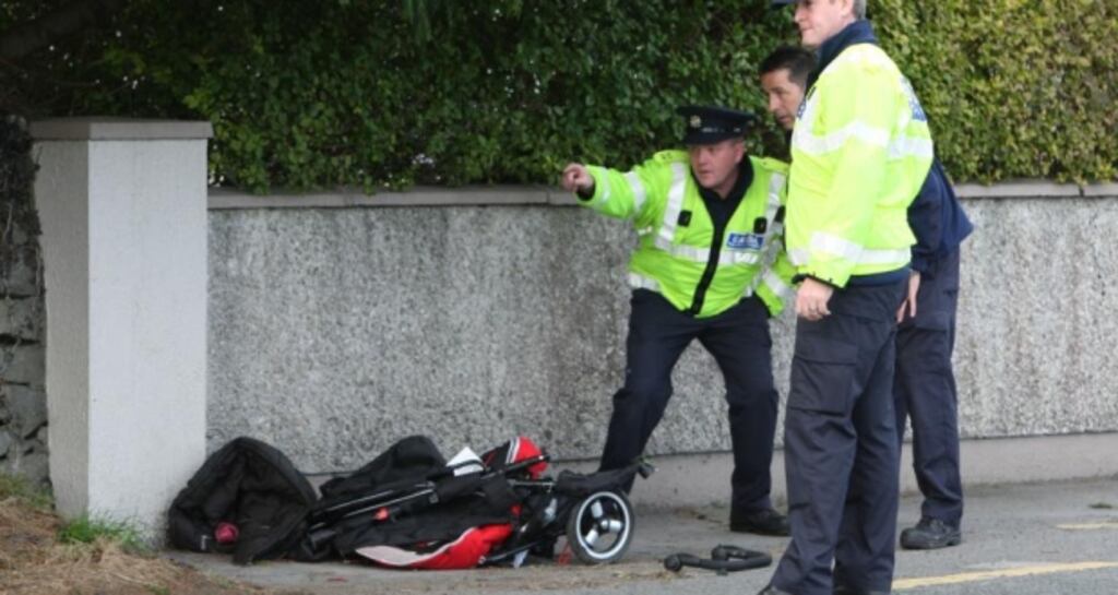 A child’s buggy at the scene of the accident on the Milltown Road outside Tuam in October 2012.