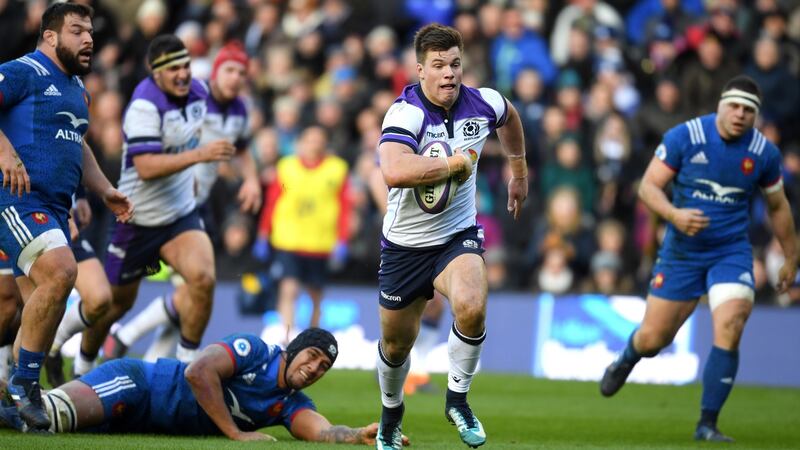 Huw Jones breaks to score for Scotland against France. Photograph: Mike Hewitt/Getty