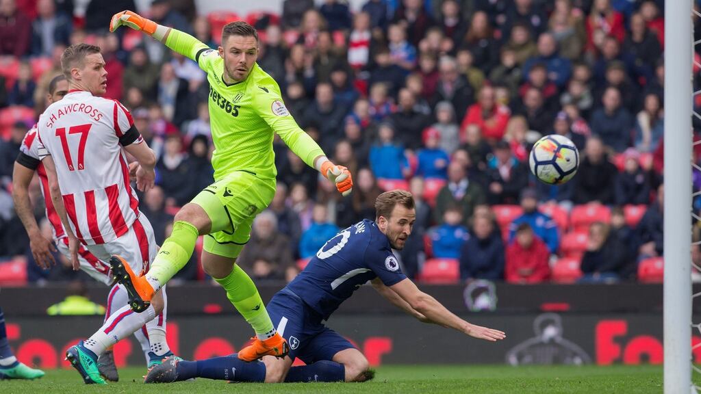 Tottenham Hotspur’s Harry Kane heads the ball past Stoke City’s Jack Butland to score his team’s second goal. Photo: Roland Harrison/Getty Images