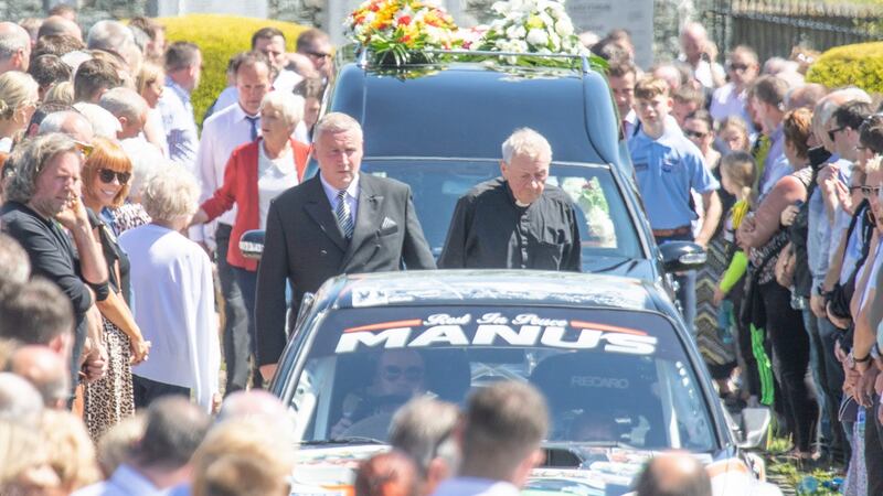 The cortege led by his car arriving at St Columba’s Church in Glenswilly, County Donegal, for the funeral of rally driver Manus Kelly. Photo: Joe Boland/PA Wire