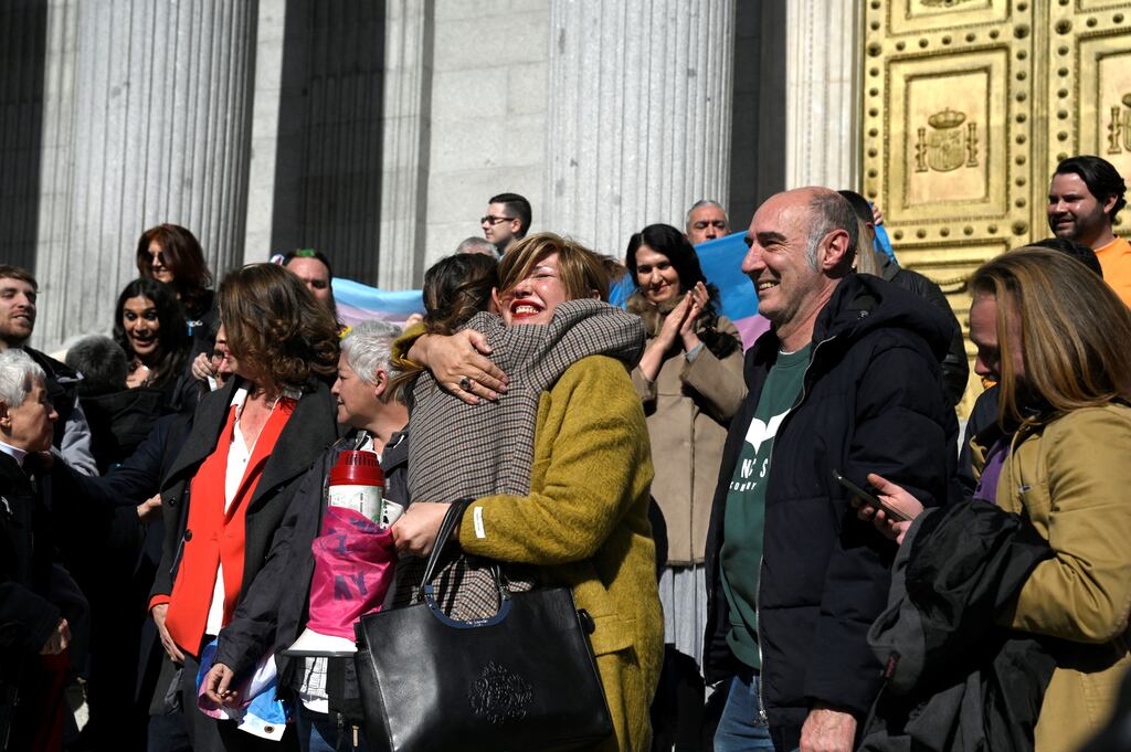 Spain's minister for equality Irene Montero hugs an activist in front of the Spanish congress in Madrid following Thursday's vote. Photograph: Oscar Del Pozo/AFP via Getty Images