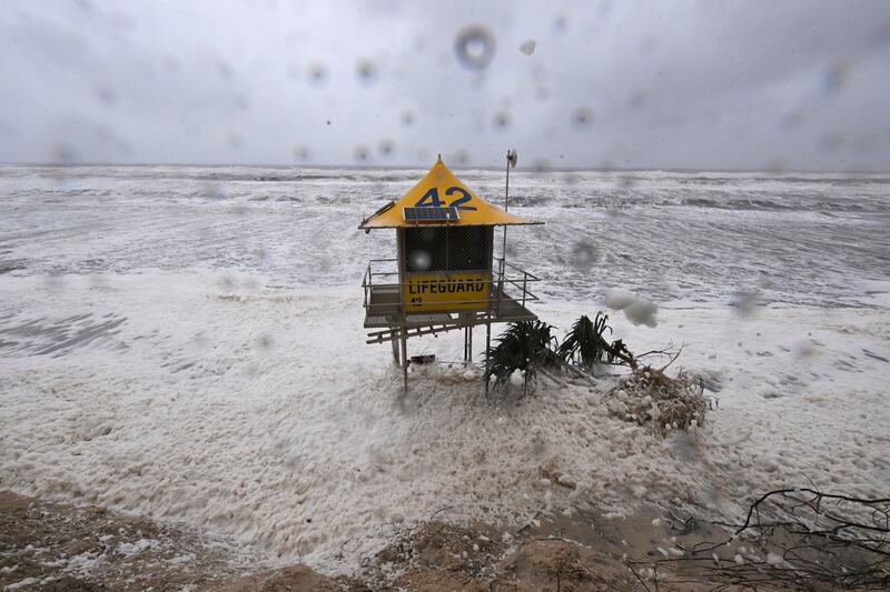A lifeguard tower is surrounded by heavy seas following Cyclone Alfred on the Gold Coast. Photograph: Dave Hunt/AAP/AP