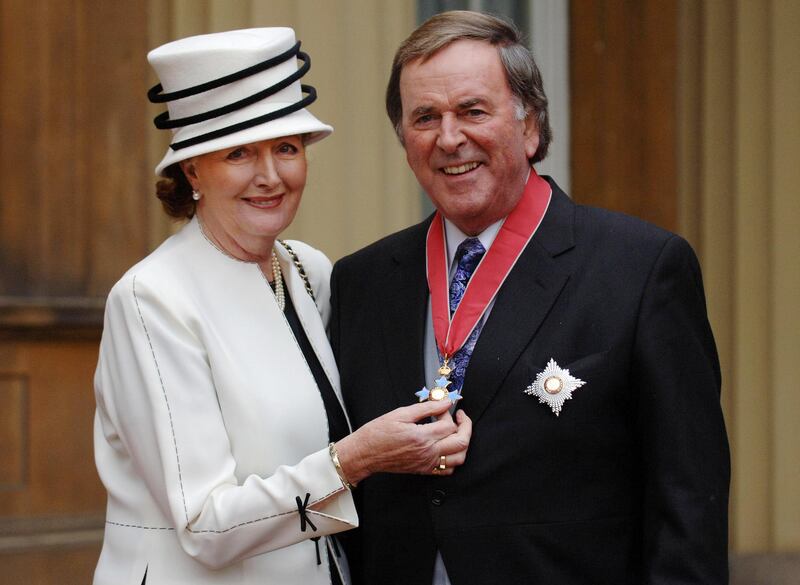 Knighthood: Sir Terry Wogan with his wife Helen, at Buckingham Palace in 2005. Photograph: Fiona Hanson/PA