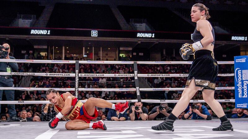 Katie Taylor knocks Rose Volante to the ground. Photograph: Tom Hogan/Inpho