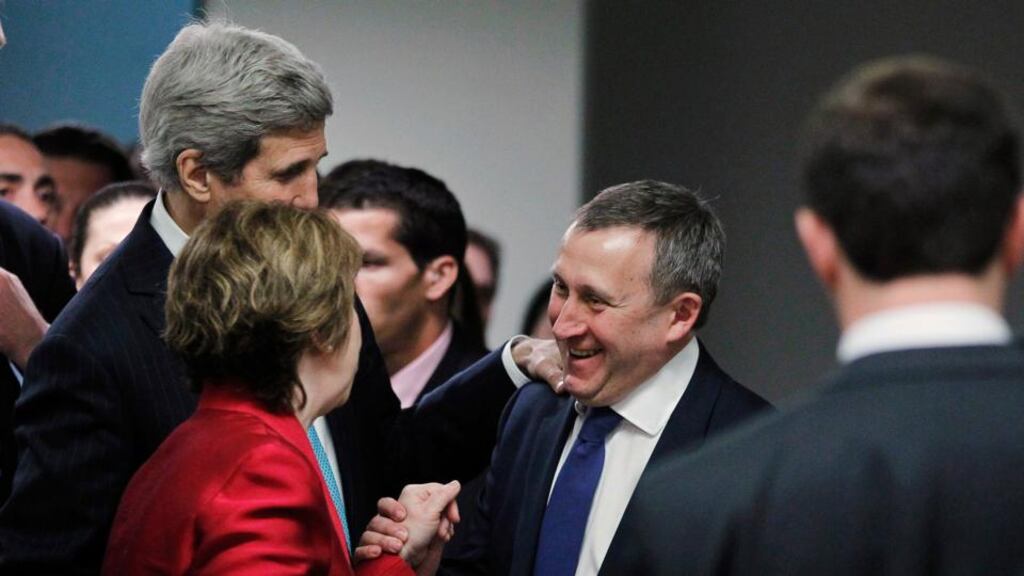 Ukrainian foreign minister Andriy Deshchytsia (right) stops US Secretary of State John Kerry (left) and European Union High Representative Catherine Ashton (centre) in a hotel hallway behind the scenes to thank them for the results of a quadrilateral meeting on Ukraine that had just ended between representatives of the United States, Ukraine, Russia and the European Union in Geneva. Photograph: Jim Bourg/Reuters