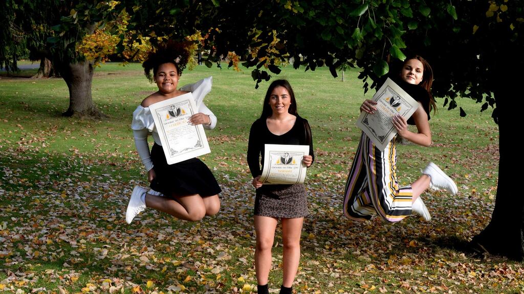 Clodagh Hayes (centre) who was awarded a bronze medal for bravery after she saved a boy from the river Lee with Krista Valteris (left) and Keisha Moloney from Carlow who were awarded certificates of  bravery after they rescued and saved a boy from a pond. Photograph: Cyril Byrne/The Irish Times