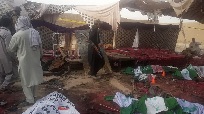 Aftermath at the bomb blast site. Photograph: Banaras Khan/AFP/Getty Images