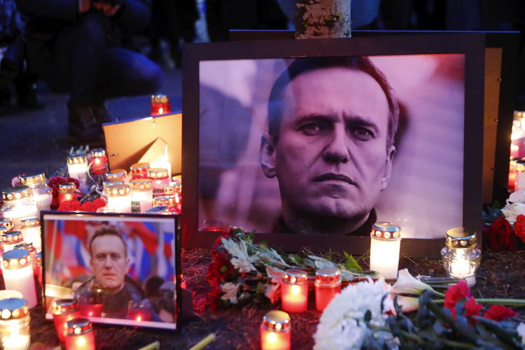 Candles and flowers placed next to photographs of the late Russian opposition leader Alexei Navalny during a vigil outside the Russian embassy in Riga, Latvia: Western leaders have been quick to suggest his death was caused by the Russian government. Photograph: Toms Kalnins/EPA