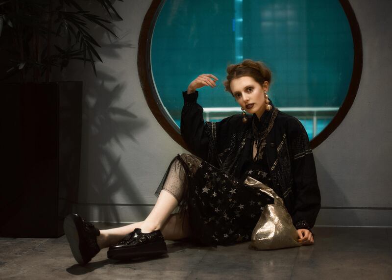 Star motif net dress €89, metallic bag €46, both from Topshop. Shoes, €289, Monreal, Cork. Earrings, €16.50, chain €24 at Isobella Ru, Cork. Vintage navy and gold star motif jacket €25, Records and Relics, Cork