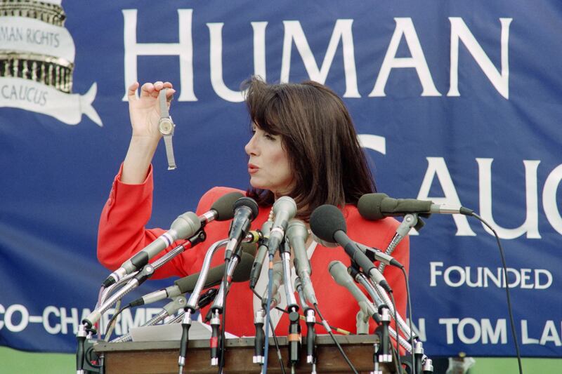 Nancy Pelosi holding a watch reportedly smuggled out of China at a rally at the US Capitol in 1991 to commemorate the Tiananmen Square massacre. She said the watches were given to soldiers who helped crush the protesters two years previously. Photograph: Chris Assaf/AFP via Getty Images