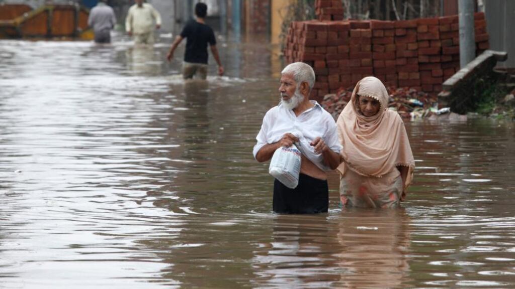 At least 73 people have been killed across Pakistan after heavy rains brought flash floods and caused homes to collapse in the Punjab and Kashmir regions. Photograph: Mohsin Raza/Reuters