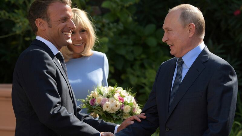 French president Emmanuel Macron and French first lady Brigitte Macron meet Russian president Vladimir Putin at Fort Bregancon near the village of Bormes-les-Mimosas. Photograph: Sputnik/Sergei Guneevn/Kremlin