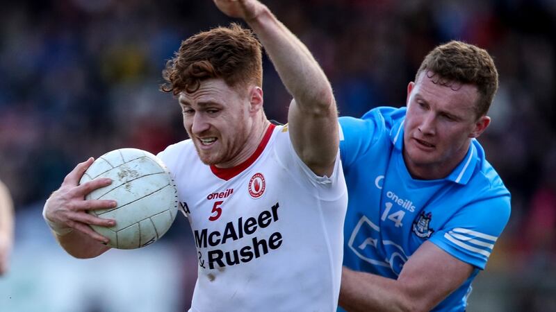 Tyrone’s Conor Meyler is tackled by Ciarán Kilkenny of Dublin during the Allianz Football League Division One match at O’Neill’s Healy Park in Omagh. Photograph: Evan Treacy/Inpho