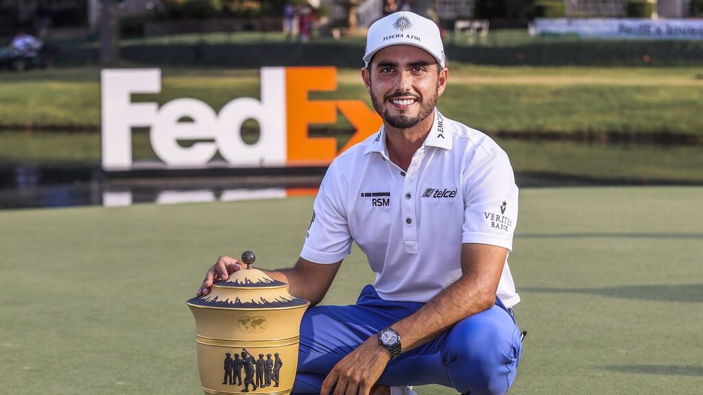 Abraham Ancer of Mexico poses with the trophy after winning the World Golf Championship FedEx-St Jude Invitational. Photo: Tannen Maury/EPA