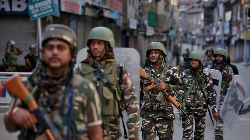 Indian security forces personnel patrol the streets of Kashmir’s capital, Srinagar. Photograph: Danish Ismail