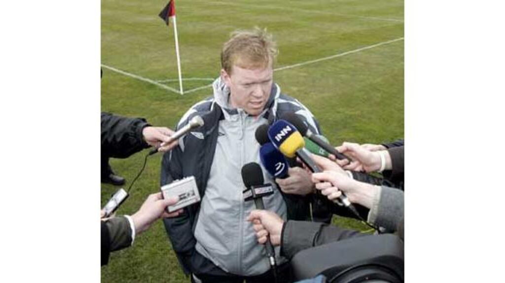 Republic of Ireland manager Steve Staunton gives his 32-second
pitchside conference to the waiting media after training at
Malahide yesterday. Photograph: Donall Farmer/InPho