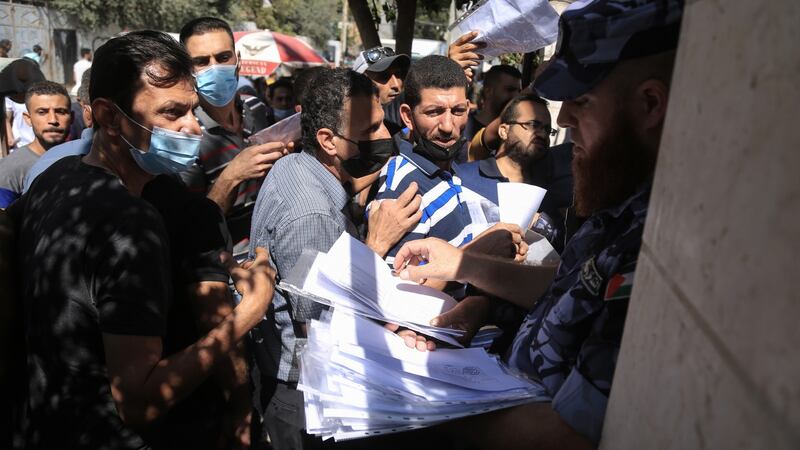 Crowds gather at the Chamber of Commerce in Gaza City in October 2021 to apply for some of the 10,000 work permits that Israel was offering Gazans. Photograph: Samar Abu Elouf/The New York Times