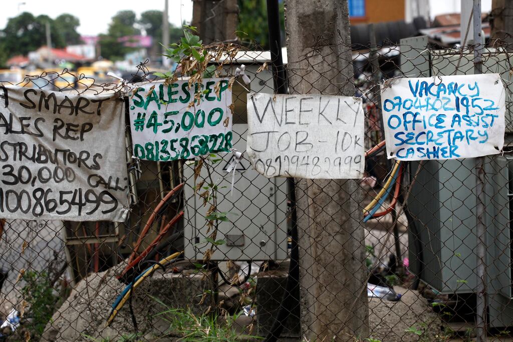 Job adverts hang on a barricade along a road in Lagos, Nigeria. File photograph: EPA