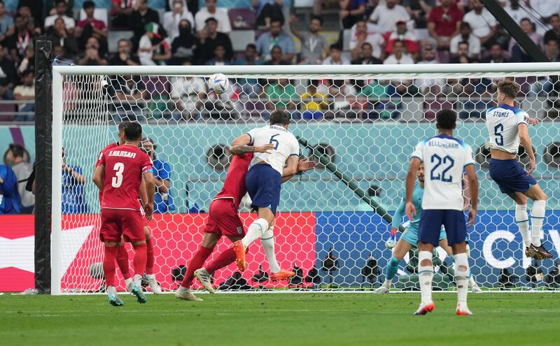England's Harry Maguire hits the frame of the goal with a header during the 6-2 win over Iran in Doha. Photograph: Martin Rickett/PA