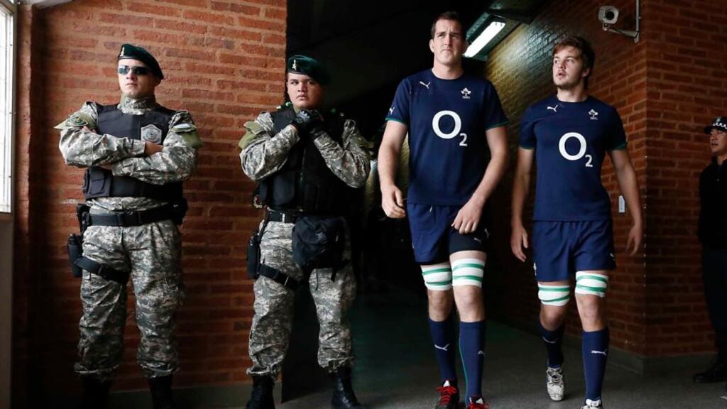 Ireland ‘s Devin Toner and Iain Henderson comes out for the Captain’s Run past soldiers at the Estadio Centenario, Argentina. Photograph: Dan Sheridan/Inpho
