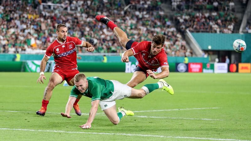 Keith Earls collides with German Davydov. Photograph: Dan Sheridan/Inpho