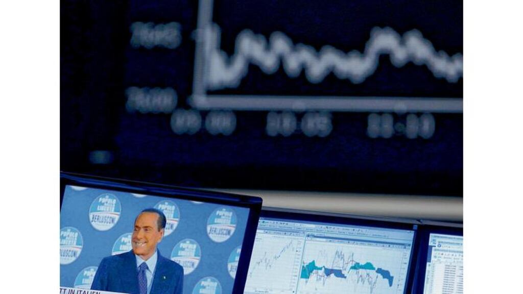 Silvio Berlusconi onscreen at Frankfurt stock exchange: the markets are alarmed at the poll outcome. photograph: lisi niesner