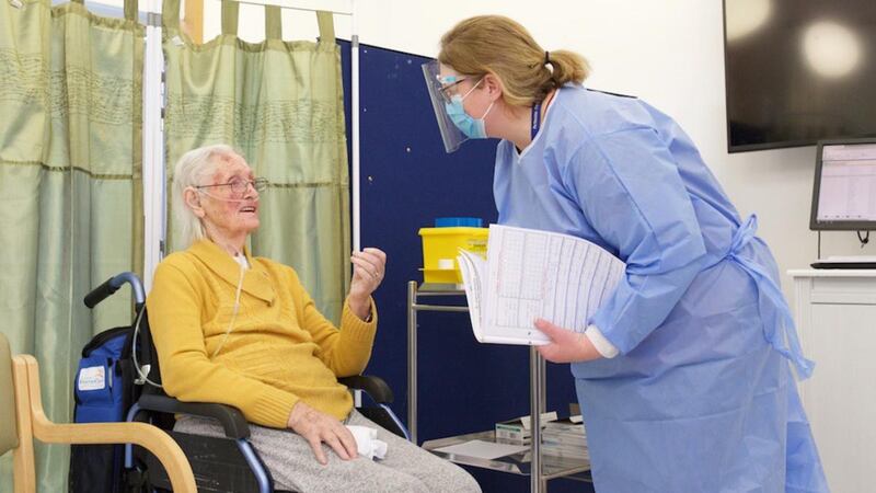 Maura Byrne (95), who lost her husband to Covid-19, is the first nursing home resident to receive the coronavirus vaccine at St James’s Hospital in Dublin. Photograph: Anthony Edwards/PA Wire