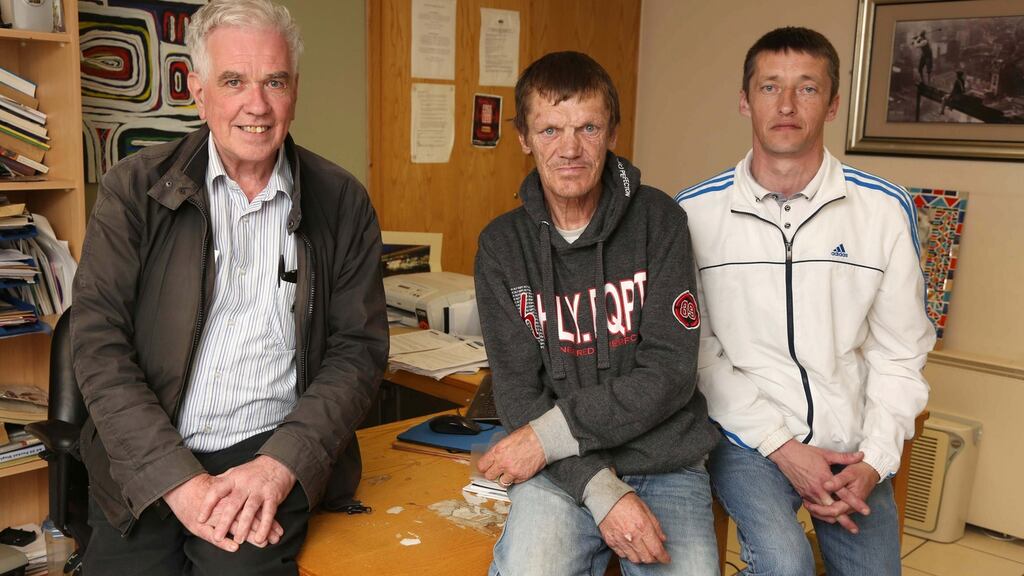 Hands-on approach: Peter McVerry in his inner-city Dublin office with Paddy Fay, centre, and Keith McAnaspie.