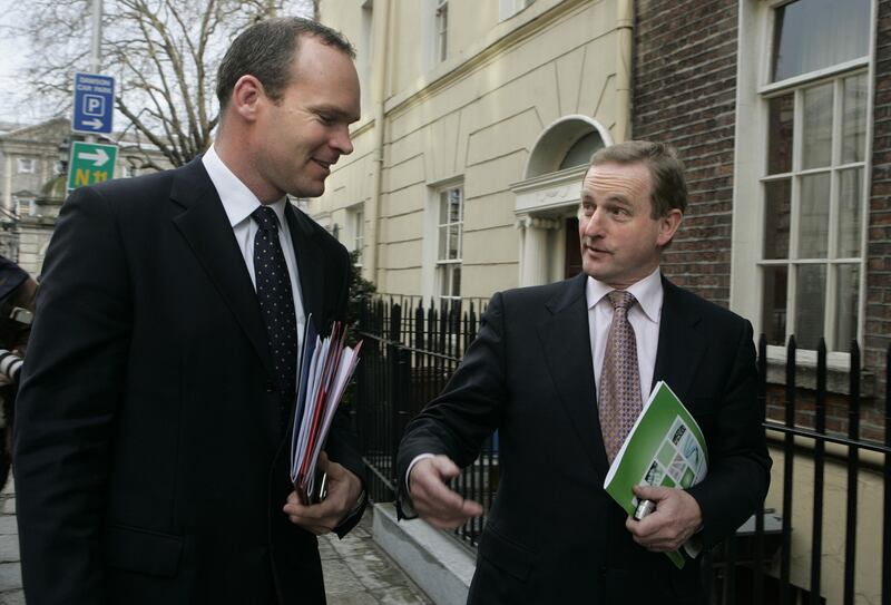 The then Fine Gael leader Enda Kenny, right, and communications spokesman Simon Coveney in January 2008. Photographer: Dara Mac Dónaill