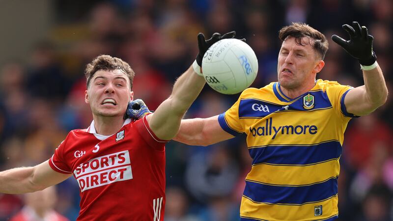Cork’s Daniel O'Mahony intercepts a pass to Roscommon's Diarmuid Murtagh. Photograph: Leah Scholes/Inpho