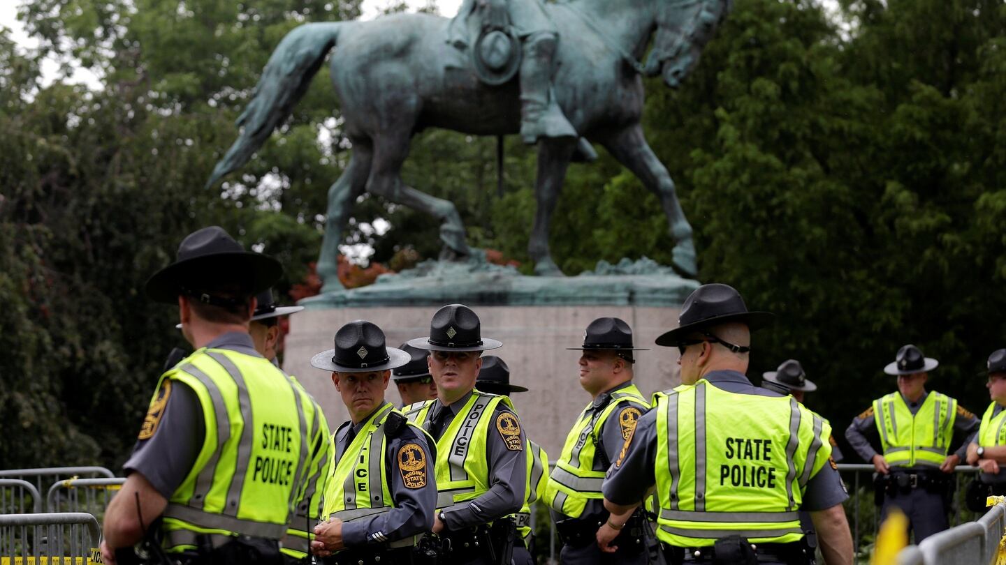 Virginia state troopers stand under a statue of Robert E Lee before a white supremacist rally in Charlottesville, Virginia, US. Photograph: Joshua Roberts/Reuters