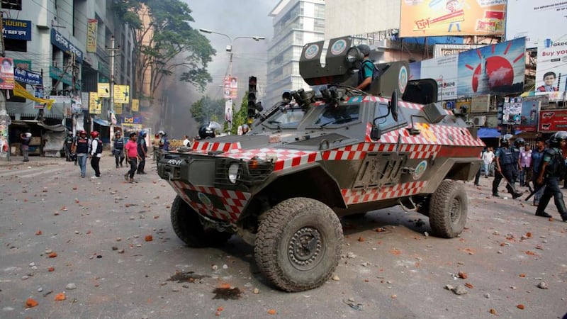 An armed police vehicle is seen during clashes between activists of Hefajat-e Islam and the police in front of the national mosque in Dhaka last night. Photograph: Andrew Biraj/Reuters