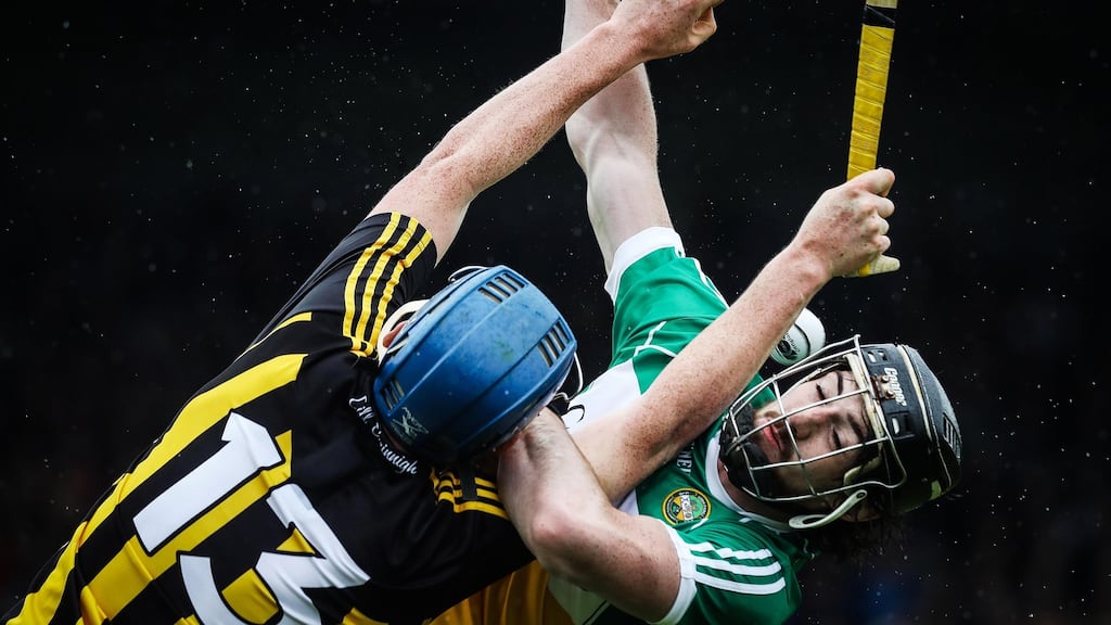 Kilkenny’s John Donnelly and Ben Conneely of Offaly compete for the ball. Photograph: Lorraine O’Sullivan/Inpho