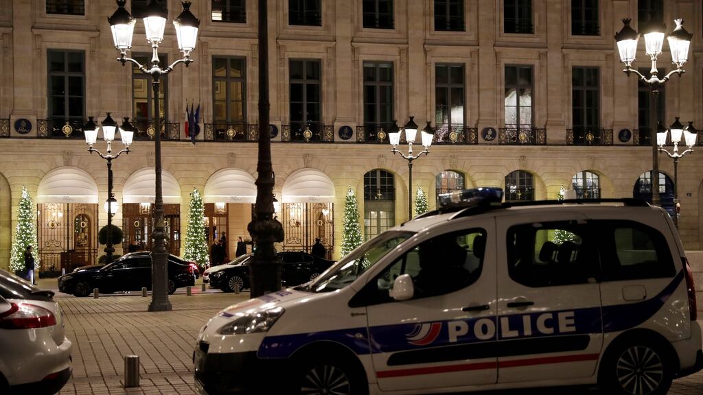 Police car parked outside the Ritz luxury hotel in Pari after an armed robbery on Wednesday. Photograph: Samson Thomas/Afp/Getty Images