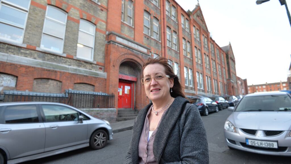 Sarah Kelleher, chair of the Lourdes Community Youth Service, outside  the former Rutland Street school. It appears a promise to refurbish the building is about to be reneged on. Photograph: Alan Betson