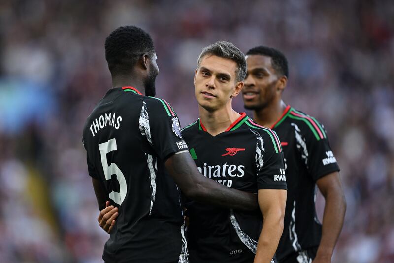Leandro Trossard of Arsenal celebrates scoring his team's first goal against Aston Villa with teammate Thomas Partey. Photograph: Shaun Botterill/Getty Images