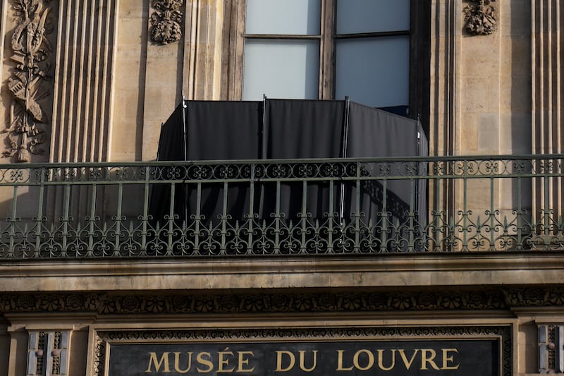 A black curtain covers the window where thieves entered the site (Thibault Camus/AP)