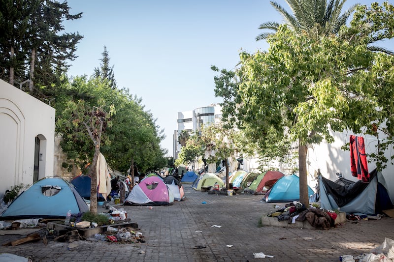 About 100 west Africans are camping outside the UN's International Organisation for Migration in Tunis, saying it's the only place they feel safe. Photograph: Sally Hayden
