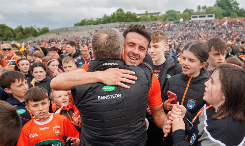 Armagh’s Stefan Campbell and manager Kieran McGeeney celebrate the victory over Donegal in the Ulster SFC Final at St Tiernach's Park in Clones. Photograph: James Crombie/Inpho